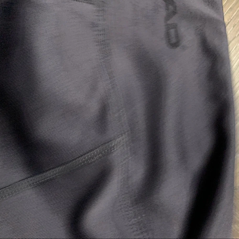 Head gray athletic pants turquoise on back legs Size XS